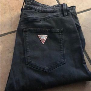 Black acid washed skinny Guess jeans.